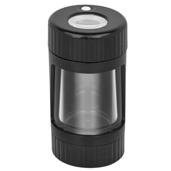 Et klart, glaskomprimeret jar med en tæt skruelåg i metal. Jarret har en cylindrisk form og en glat overflade, der tydeligt viser indholdet, som består af tørrede blomster med varierede nuancer af grøn, brun og lilla. Låget har en sølvfarvet finish og en simpel, rund form, der passer snugly på toppen.