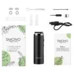 En kompakt vaporizer præsenterer sig med en glat, rund form i en blød, mat finish. Farven er en dæmpet grå, der giver et stilrent udtryk. Kontrolknapperne er diskrete og placeret på fronten, mens en lille skærm viser information. En udluftningsåbning er synlig på siden, og den samlede konstruktion fremstår robust og ergonomisk.