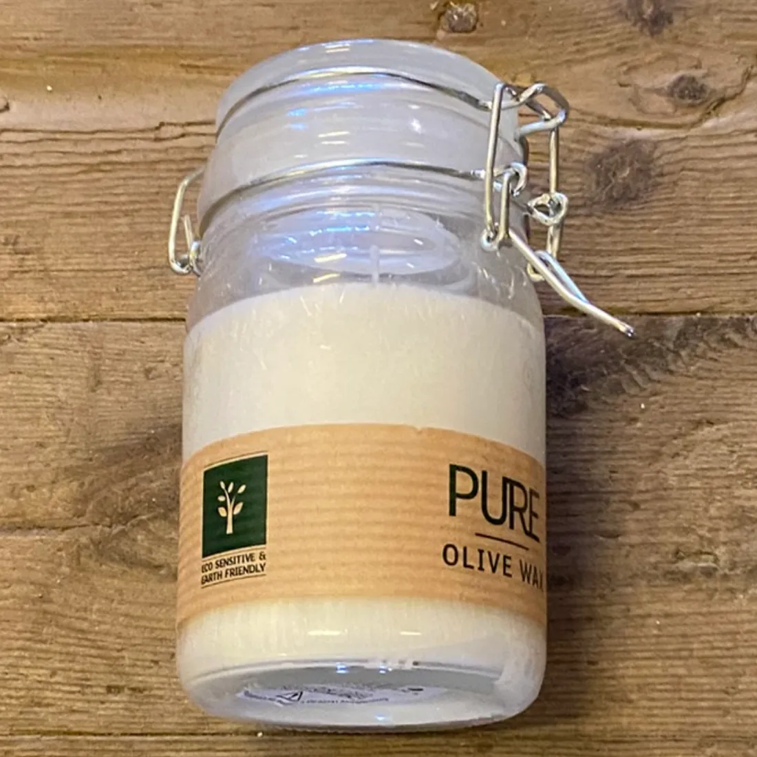 Pure Olive Wax Jar Candle White 120×70 cm i klart glas med bøjlelåg og brun etiket med teksten "PURE" i sort.