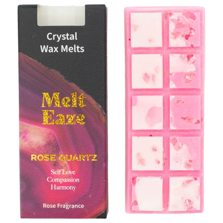 Melt Eaze Rose Duftvoks i lyserød bakke med hvide stykker. Sort æske med lyserødt mønster og "Melt Eaze" i guld.