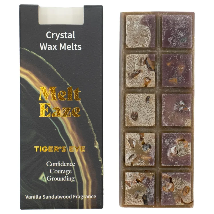 Melt Eaze Vanilla Sandalwood Duftvoks i cremefarvede og støvet lilla felter med små sten. Sort æske med "Melt Eaze" i guld.